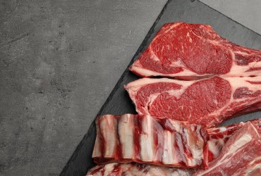 Slate,Plate,With,Raw,Meat,On,Grey,Table,,Flat,Lay.