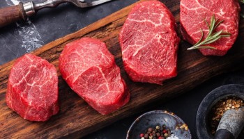 Raw fresh marbled meat Steak and seasonings on dark marble background